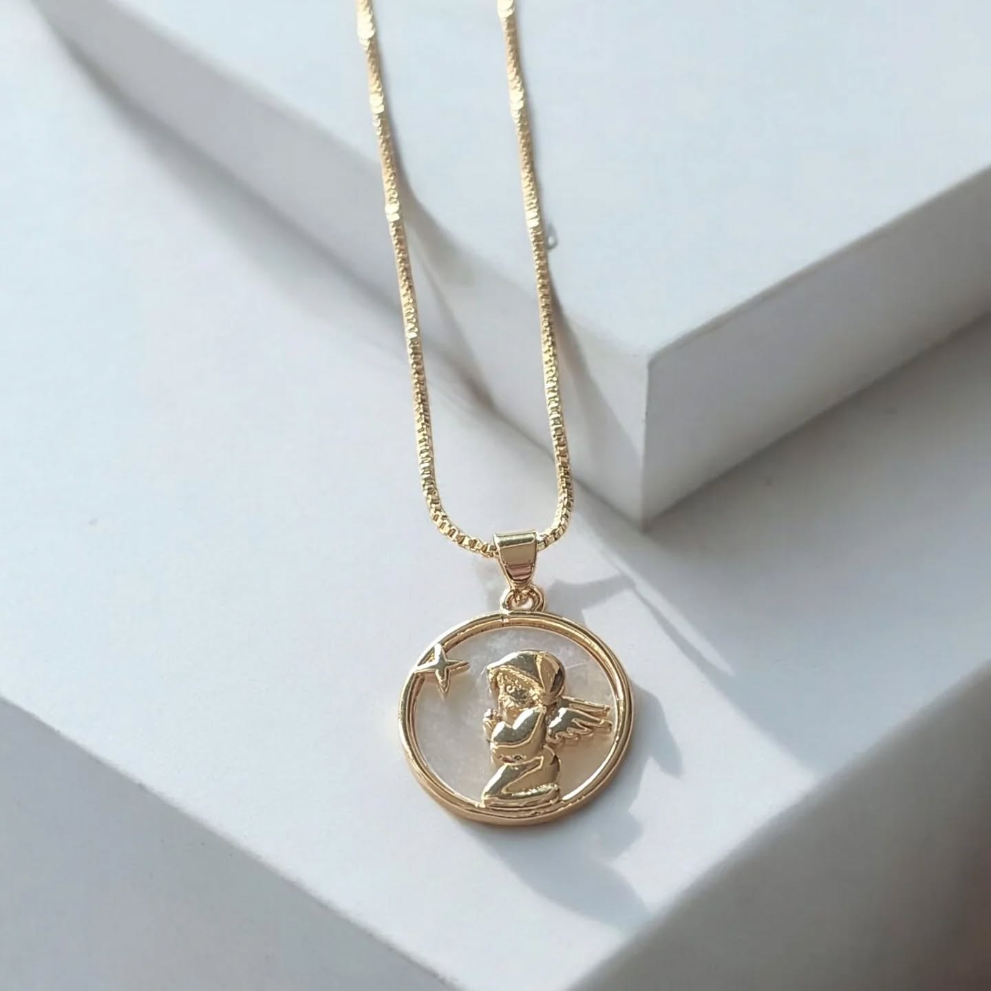 Elegant gold chain, with a delicate angel.