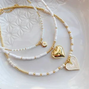Natural pearl and Heishi bead necklace with a heart pendant, Alkimia Charms jewelry